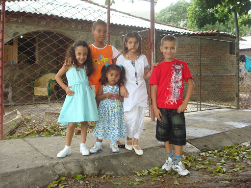 Freshman Sabrina Urdaneta and her friends pose in front of her house in Cuba. The house was where Urdaneta lived before she left for America, close to the city of Santiago de Cuba, Cuba. “All of the walls were rusty and the tiles were falling off. The floor was dirty, but in Cuba - where I lived - my house was considered a really nice house which is crazy to think about, coming to the United States and seeing what a house here looks like,” Urdaneta said.