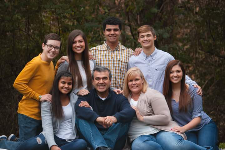 Junior Shaleigh Araya (front row, far left) poses with her adoptive family for a picture in 2019. Araya said she owes her success to her family and faith. “God has really helped me in life,” Araya said. “That’s the number one thing I [attribute] to my success. Next comes [the support] of my family and friends.” 