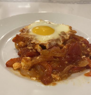 A portion of the shakshuka, plated and ready to eat.