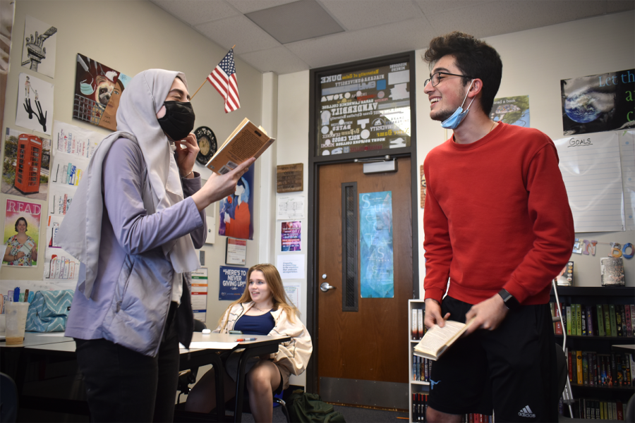 Seniors Zeina Daboul and Kayvon Rezaei give an impromptu performance of “A Doll’s House” by Henrik Ibsen in English teacher Andria Benmuvhar’s AP English Literature and Composition class. Benmuvhar’s sub plans instructed the class to audibly react to the dramatic final scene as two students read the parts aloud, but halfway through the scene Daboul and Rezaei decided to instead act. “I felt like the energy of the classroom really made me want to stand up and act it out face to face. The emotion in the play is based on [Nora and Torvald] interacting with each other, [so] it seemed more true to the play and a lot more fun,” Rezaei said. “[‘A Doll’s House’] is a very entertaining play so [when] we were told to audibly react to it, the whole class’s emotions were so authentic and raw. It made it more suiting for us to perform in a more authentic way toward each other.”