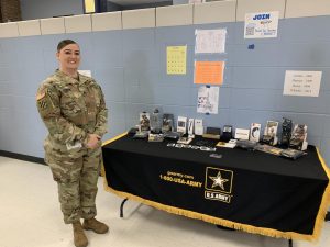 Staff Sergeant and U.S. Army recruiter Krystal Currin presents her recruitment station outside the cafeteria. Currin, who usually works in the IT field, has been in the Army for 12 years and hopes to retire in eight. “Im here to provide information [and] open up more career opportunities [for] students,” Currin said. 