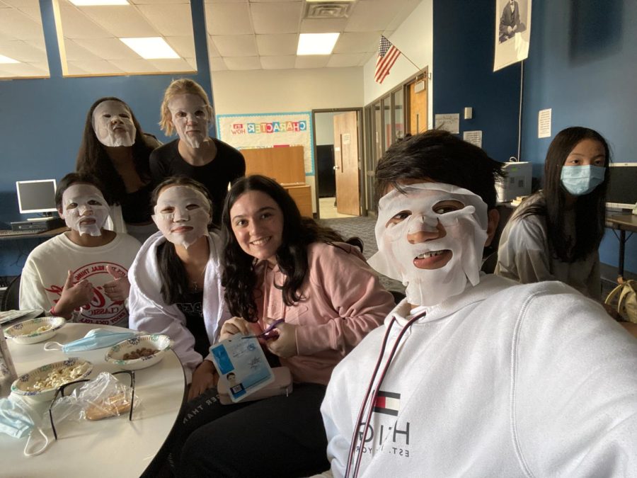 Freshman Samir Shaik and his friends pose with their face masks for a selfie. 