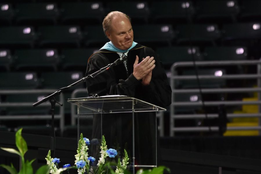 During the 54th annual graduation commencement ceremony at St. Charles Family Arena, principal Jeremy Mitchell applauds cum laude students academic achievement. Mitchell has been the principal at West High for the past 12 years and plans to retire after the 21-22 school year ends. “Kids are good. I get irritated by news reports and friends [who say,] ‘Oh, I couldn’t do it, how do you put up with those high schoolers?’ Are you kidding me? I mean, you guys are great. Anytime I doubt that something happens, and boom. So I think thats the lesson that has been verified and reinforced year after year,” Mitchell said. “Its fun because I have my own children, and when Im with those kids, its kind of the same thing. I just think the teenage years are really interesting. Thats why I work here. I’ve been going to school since 1978, and its just so fun to see the growth in students. So I think my life lesson is learned from that enjoyment.” 