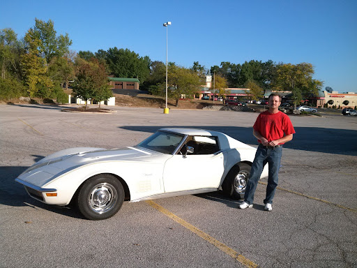 Steering towards his goals, Greg Schade poses in front of his 1972, generation three Corvette. Schade was interested in this car model because of the engine power, body style and chrome bumpers. “When I first had the idea of doing a restoration and researching for it, I thought about getting a ‘67 Corvette, a C2 generation. But I dont like the way it looks as much. I like the C3s more, and they’re less expensive, so it was a no-brainer,” Schade said.

