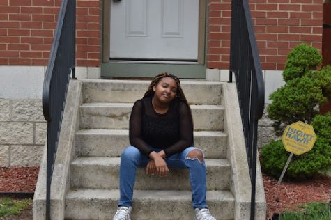 Sophomore Elizabeth Franklin sits in front of her old house in Old North, St. Louis. Franklin spent half of her life living in St. Louis with her family. 