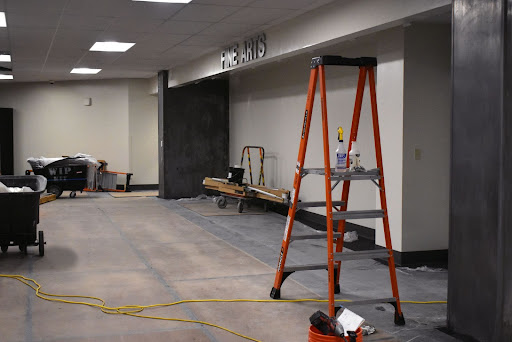 Construction tools stand throughout the partially-finished entrance to the Fine Arts wing. The entrance will be a glass display case featuring students’ artwork. “[I’m excited about] everything being so fresh and new. For art teachers, I would say our department is very clean. [The new department] is going to be ready to organize and allow for procedures to be a lot more accessible [and] manageable,” Art Department Leader Katy Mangrich said.