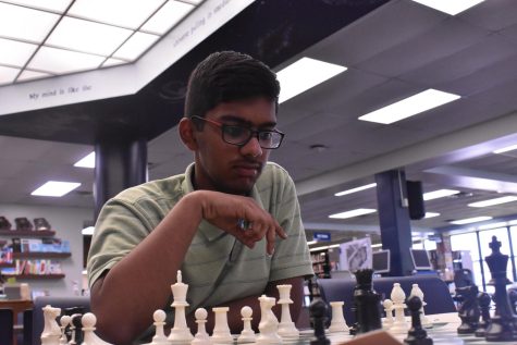 Sophomore Karthik Dulla decides his next move as he plays a game of chess against himself. Dulla learned to play chess in India since it was the only thing he could do to pass the time. “You don’t have to be smart to play chess, all you need to know is how all the pieces move, and then you can take a go at it,” Dulla said.
