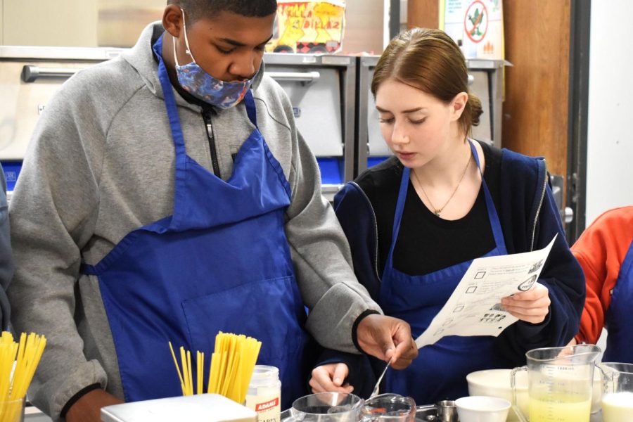Sophomore Keyshon Brown and senior Sapir Zachary measure ingredients to make a sauce for their days dish: fettuccine alfredo. In the Culinary Mentor class, neurotypical students work with kids with various disabilities to learn cooking skills. “I thought [this class] would be enjoyable and a great opportunity to help kids develop skills they can carry on later in life. It hurts my heart to see how those kids can be treated. I always wanted to be their friend and make them laugh. More people need to be considerate and nice and be someone’s friend,” Zachary said.