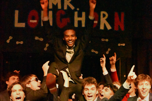 Sitting on fellow contestants’ shoulders, senior Christian Fleming celebrates his victory. Fleming was crowned “Mr. Longhorn” after a display of his occupation, talent and formal attire. “I really wasn’t [expecting to win]. I was just excited to come out on top. All the guys did phenomenally,” Fleming said.