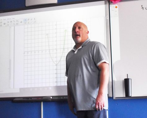 Math and computer science teacher Jason Townsend explains how to graph algebraic equations in front of the class. Townsend teaches algebra, calculus, and computer science. I love teaching calculus [because] calculus [is] more challenging [and] more interesting to me. Granted, if youre a good teacher, you find ways to make [all math] interesting for your students and you challenge yourself to do it differently all the time,” Townsend said.