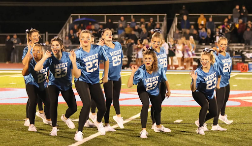 Varsity poms showcases their homecoming routine, choreographed by all senior dancers. The team mastered the dance in four days with two-and-a-half hour practices each night, on top of working with junior varsity on their choreography. “It was my first time creating a routine [choreographed] with more than one person, which was stressful because there were a lot more minds and ideas. But after the final performance, it was all worth it. I was proud of how it turned out,” senior Kelsea Wilson said. 
