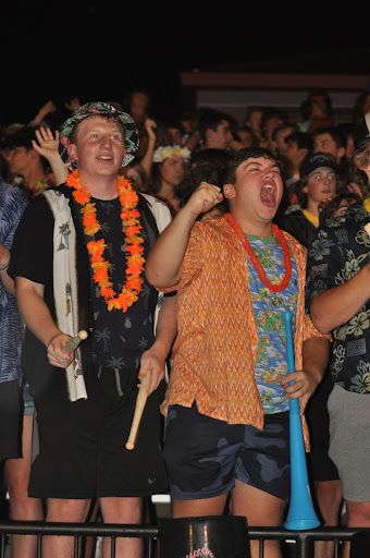 Seniors Cooper Walkoff and Tyler Lang scream at a Hawaiian-themed football game versus Hazelwood Central on Sept. 2. As an associate of the @PWestSuperfan Instagram, Walkoff believes the front of the bleachers is reserved for seniors. “Seniority is always in place, it’s student section etiquette, and we want the best student section possible. It’s important for seniors to be in the front row because they have been at West the longest and have more passion for West athletics than the rest of the students,” Walkoff said. 