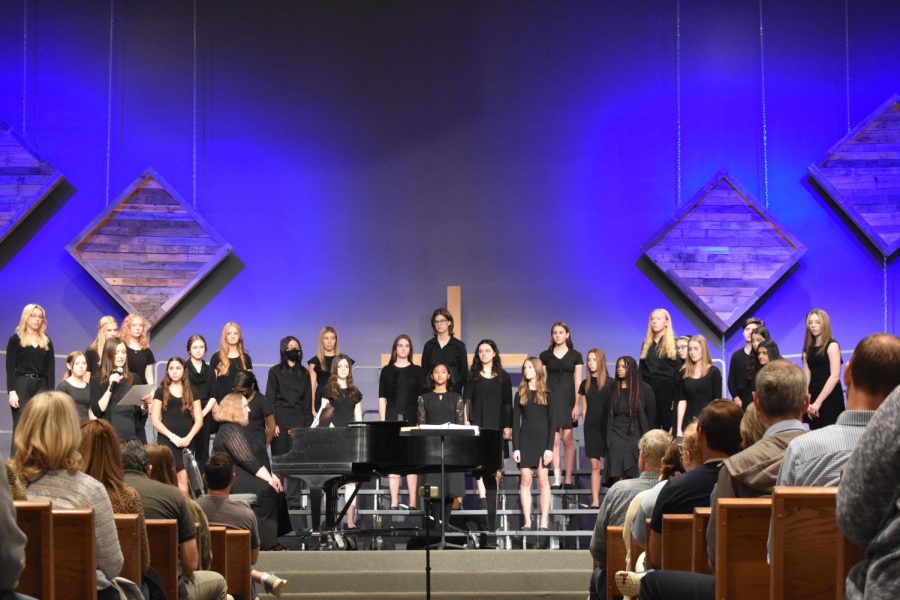 Earlier+in+the+year%2C+chamber+and+concert+girls+stand+in+front+of+the+crowd%2C+ready+to+begin+their+show+at+Chesterfield+Presbyterian+Church.+On+Oct.+20%2C+sophomore+Gianna+Lionelli+and+her+fellow+choir+members+gathered+for+their+first+concert+of+the+year.+%E2%80%9CIts+cool+to+perform+on+stage+with+other+kids+who+are+passionate+about+music+because+its+a+way+to+foster+creativity%2C%E2%80%9D+Lionelli+said.+