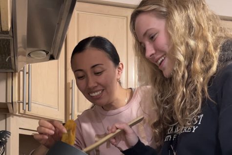 Senior Ava Kayser cooks a meal with her nanny Angela Cupajita. Kaysers parents wanted her to learn a different language growing up and hired Cupajita to teach her. 