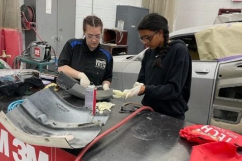 Applying epoxy to a broken car bumper, freshman Ruthvi Tadakamalla assists a Southern Technical (South Tech) student in the Auto Collision Repair program. Forty freshmen registered to tour the campus and participate in hands-on experiences to give them a taste of South Tech programs. “I learned that there [are] other careers I could do besides pre-med. Before I went, I wasnt thinking that I might like them, but I did like doing a lot of the things that we did,” Tadakamalla said.
