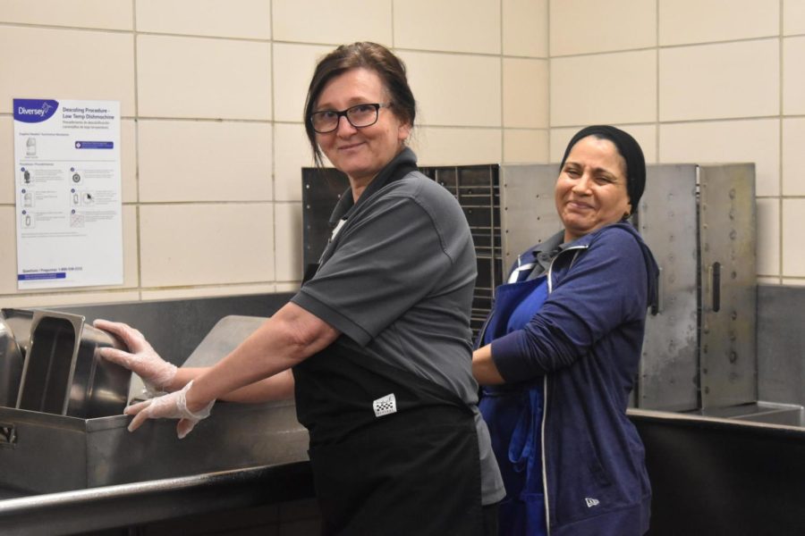 Cafeteria staff members Edina Husic and Souria Benchabane smile and laugh as they wash the days dishes.  Parkway School District partnered with Chartwells for food service needs.  “The camaraderie that we all have back there, its like a big family. I think thats my favorite time for everybody,” West High chef Timothy Kennedy said. 