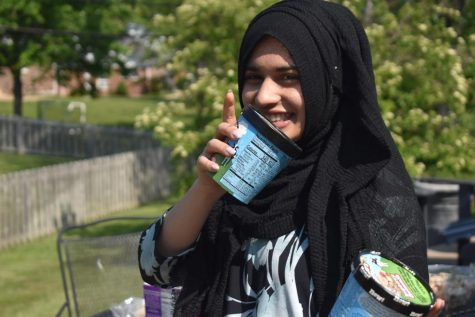  Freshman Zoya Hasan smiles as she holds up Ben and Jerry’s Cherry Garcia and Raspberry Cheesecake ice cream. Hasan and freshman Sophie McCarthy found a passion for review writing during Convergence Journalism 1. “I’m funny and it gives me an opportunity to show that,” Hasan said. 