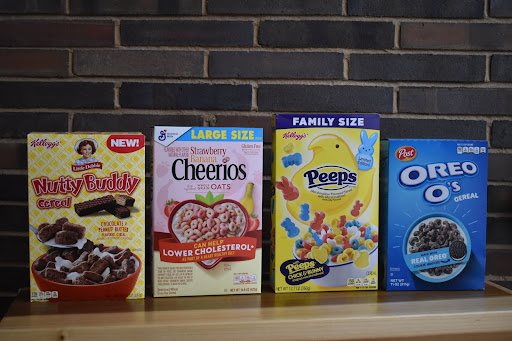Boxes of Nutty Buddy Cereal, Cheerios, Peep Cereal, and Oreo-Os in a line.