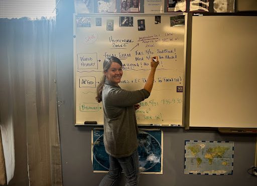 Social studies teacher Amy Thornhill writes her daily class agenda in front of the whiteboard. Thornhill teaches AP Human Geography, World History and Psychology and has witnessed difficulty for students to form an opinion recently in all of these classes. “Everyone's opinion is valid. Everyone's opinion is justified. But [when] you have so many opinions. It's hard for kids to figure out their [own]. Those are the things I try to articulate and get kids to understand,” Thornhill said.