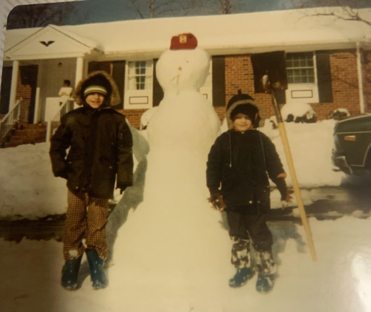Business and personal finance teacher Andy Croley (left) stands beside his brother in front of the snowman they built. Croley often enjoyed  making snowmen with his brother. “We had five or six acres of land, so we always had lots of snow [to] make snowmen,” Croley said. 