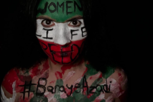 Senior Dana Zafarani poses in paint reading “Women, Life, Freedom” and “#BarayeAzadi” as a protest against the Iranian government. The experiences of Iranian women inspired Zafarani to assist in any effort to protect women’s rights. “The world should live in peace. Every woman deserves to be equal. Every woman deserves love [and] kindness,” Zafarani said.