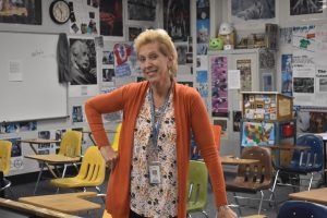 Social studies teacher Nancy Sachtleben stands in front of her classroom. Sachtleben attended West in her high school years and returned to the school to teach. “You look back and realize how fortunate you are to be at Parkway West High School. I tell these kids every day to take advantage of this free education. You don't realize where you are. I've had kids that have gone to college and come back, and they're like, ‘I am so much more prepared than some of these other kids.’ And I [tell them], ‘Yeah, you went through Parkway West.’ Kudos to the English department because they get [the students] writing with critical thinking skills. It's just a great school. I'm so fortunate to have gone here and still be here,” Sachtleben said.