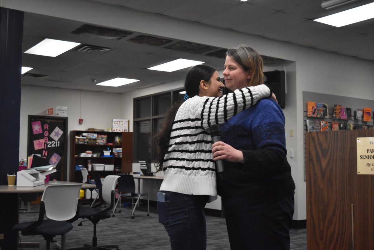 Smiling widely, senior Dana Zafarani embraces English teacher and contest organizer Andria Benmuvhar after being announced as West’s 2024 Poetry Out Loud champion. Zafarani will represent West at the regional competition in February. “I’ve done Poetry Out Loud for the last two years. I’m a senior now, so I want to make it count,” Zafarani said.