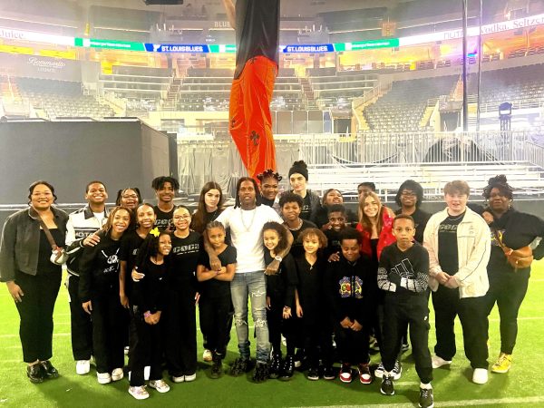 Junior Jack Mullen (back row, seventh from the left) smiles with American rapper Lil Durk and the Center of Creative Arts children’s choir. Prior to the choir’s performance, Durk introduced himself to the students and thanked them for assisting him. “[He] walked down and shook each of our hands. We got pictures and talked with him. It didnt feel real. Hes just a guy, but at the same time, his music is so special to a lot of people. The fact that we got to interact with the body, mind and spirit of the person whos making this art, thats cool. We felt welcomed,” Mullen said.

