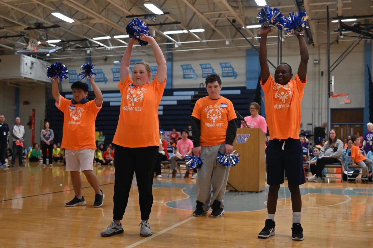 Performing a dance, athletes wave their pompoms in the air as special education teacher Wendy Zieleskiewicz stands behind them. Zielesckiewicz, who has been teaching for 25 years, didn’t know what she wanted to pursue until she remembered her love for children. She now sees her students benefiting from Special Olympics. “Its really fun to see [athletes] grow. [Special Olympics is] incredible — Its high energy, its a lot of fun. Its cool to see the kids all working together and having a good time. They make connections with other students, [and] its amazing to see how much fun they have. I hope that they can make and maintain relationships with people that are not in this classroom. I always encourage [my students] to participate [in Special Olympics] because it is a lot of fun and even if they dont make a best friend, you still have an opportunity to grow,” Zieleskiewicz said.