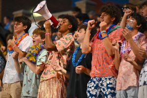 Cheering front and center, senior Jacksen McNeal steps up to lead the student section during the first home football game of the season. As one of the seniors running the Parkway West superfan Instagram account, McNeal helped pick the tropical theme and promote the game online. “It was super fun having the microphone [and] leading the student section — I’ve been here for four years watching all the other seniors do it [and] now I’m a senior. Even though we didn't win, we were all hyped and supported the team,” McNeal said.