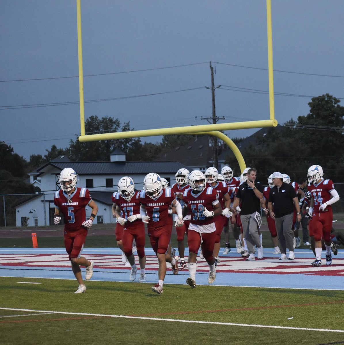 The Longhorns, along with freshman Gunnar Holmes, head back to their bench after a productive halftime talk during their game against Seckman High School on Aug. 30. West fell short to the Jaguars. "I've been playing since fifth grade, so that's four years. [I’m looking forward to] getting to know my teammates better. I think a good teammate has to put the team above themselves. You can't be selfish,” Holmes said. 