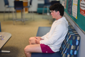 Senior Griffin Beno waits in the counseling hub. Students were allowed to visit counselors without an appointment on Aug. 15 and 16 to adjust their schedules, resulting in long wait times. “There [were] not as many [people at open hours last year], but I think that was because we didn't get the word out as well,” counselor Jen Wibbenmeyer said.