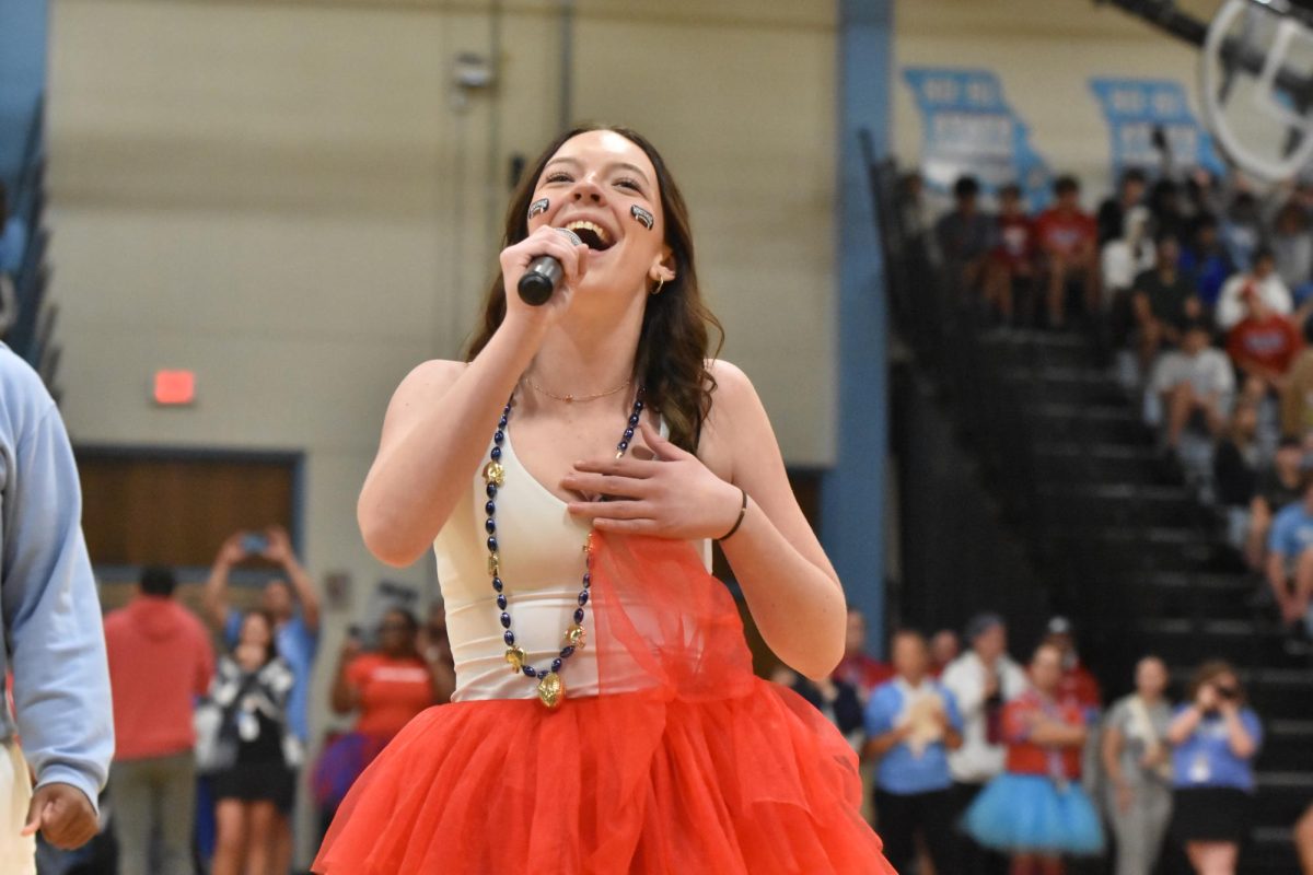 Serenading her class to the tune of “Dynamite” by Taio Cruz, junior Olivia Owens makes her debut appearance as a member of the Jazz Choir. Owens has been a part of the choir program since her freshman year; last year, she auditioned and became one of 16 students selected as a member of the prestigious performance group. “It was nerve-wracking to perform in front of the whole school, but it was fun. It takes a lot of practice, but my confidence comes from the support of my group, my teacher and knowing that everybody's there for me,” Owens said.
