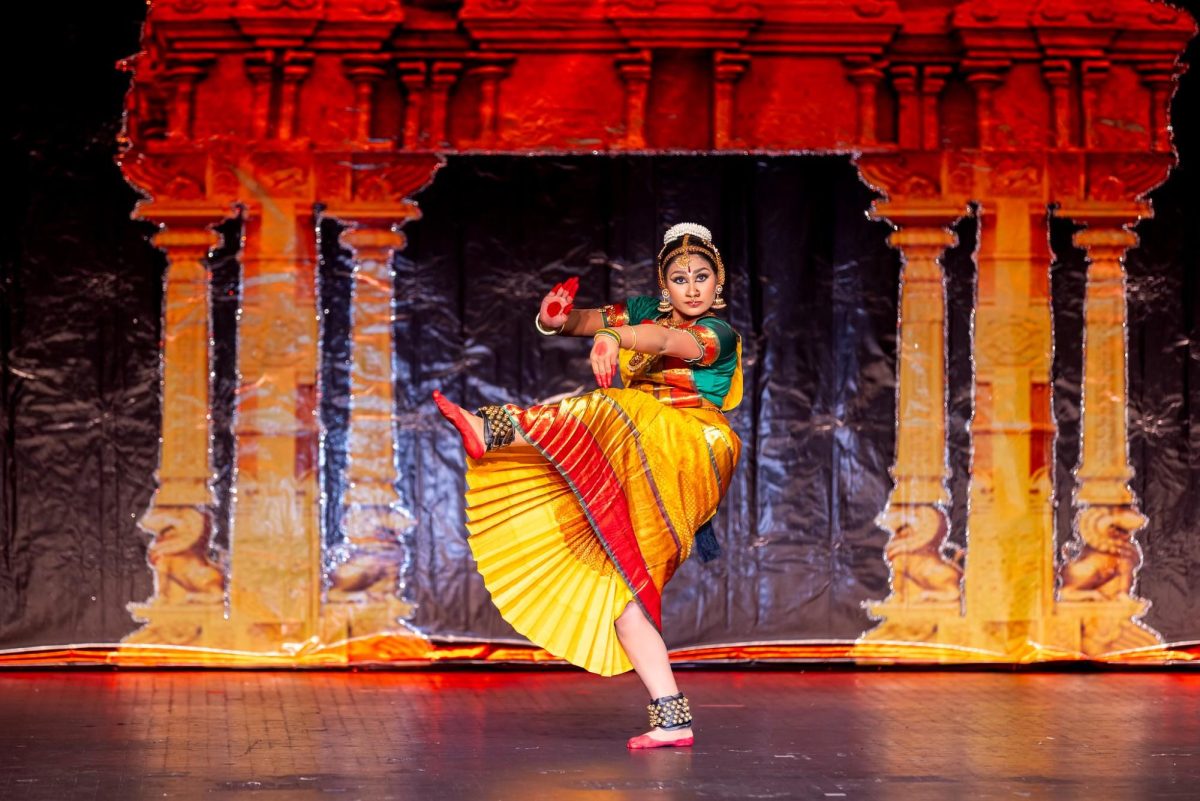 Junior Sravya Guda dances at Clayton High School to showcase her debut performance: the arangetram. The performance was the culmination of years of effort and preparation from Guda “This was my first time performing with a live orchestra. Usually, in St. Louis, a lot of students don't perform with a live orchestra for everyday events. If you're in India, it's a norm that you perform with a live orchestra, but it's harder to find here,” Guda said.