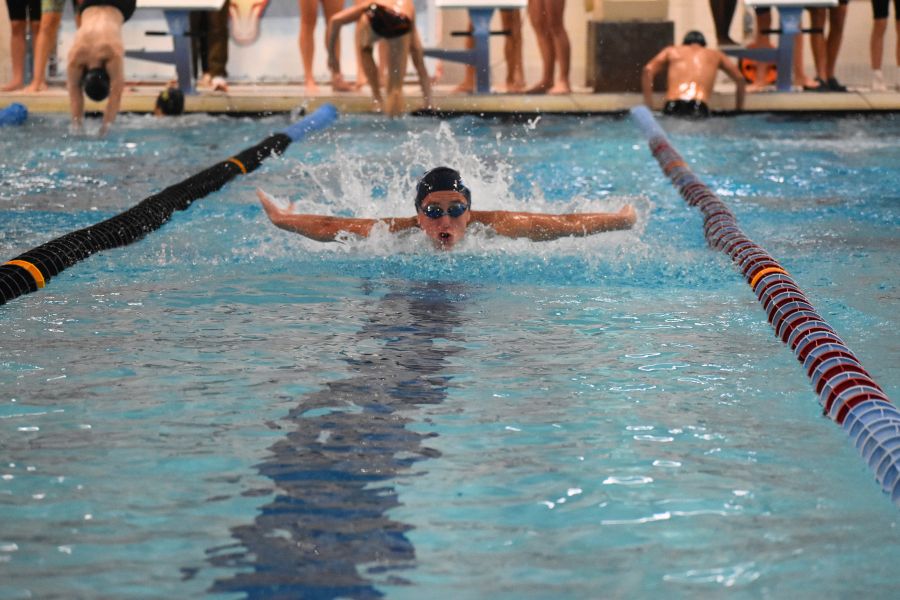 “[My favorite thing about freshman year has been] making friends with the seniors on the swim team. Being around my teammates has made me really excited [about future years on] the team. [One] challenge so far has been the meets because of how fast the competition is compared to club. My friends and teammates help me the most. They pushed me in practice to help me [improve]. [My teammates] like to chant my name or say, ‘This is where your hard pays off, dont let it be for nothing,’ or ‘Don't chase them, let them chase you,’ which helps me. Swimming has shaped me to be [who] I am today, and [pushed me to] work hard and develop my mind. The best part of swimming is [seeing my] improvement and knowing I will get better through my hard work.” - Mason Moellering, 9 