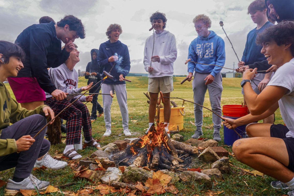 Dropping his hotdog directly into the fire, senior Jake Boland bursts out laughing with his Adventure Pursuits classmates. As a team bonding exercise, they were tasked with building a fire using sticks collected the day prior. “We were having a good time grilling our hot dogs until mine got a little hot [and] snapped right into the fire. [I] had to go in there [with my] bare hands into the fire and save my wiener. I ate that wiener, [and] it was good. Then I tried to make a second hot dog, and that one fell directly into the fire, and I was not going in again,” Boland said.