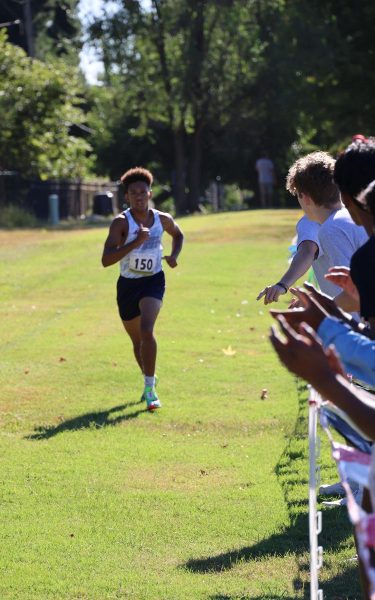 Junior TJ Polack sprints toward the finish line at the annual Parkway Quad 5K. He led a victory for his team in the junior varsity race, finishing in first place. “I've been loving cross country a lot more. Running was never something I was too particularly good at, and it’s been something I really wanted to change over the course of my high school career. Coming from middle school, I found it a little embarrassing how slow I was, so I made it a point that I didn't want to feel that way [again],” Polack said. (Photo courtesy of Kristen Witt)