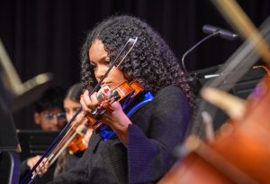 Drawing her bow, junior Gracie McLeod performs with chamber orchestra at the annual fall orchestra concert. To prepare for the concert, McLeod spent time during AcLab and practiced together with the symphonic orchestra. “[The concert] was pretty exciting. It was
the first concert of the year, and I was really excited to play ‘Just What I Needed’ because it's a well-known song. [But,] watching symphonic play was definitely my favorite part because they always play beautifully each time,” McLeod said.