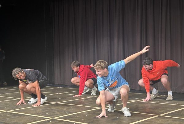 Kicking off dress rehearsal, Mr. Longhorn contestant and senior Carson Hughes goes over the group routine alongside other competitors. With just two days of practice, all participants learned the entirety of their introductory dance, chose an occupation to embody and crafted skits for the show. “The best part of this [whole thing] was learning the dance and just practicing with the guys. We [have to] try not to laugh the whole time, but we're having a lot of fun,” Hughes said.