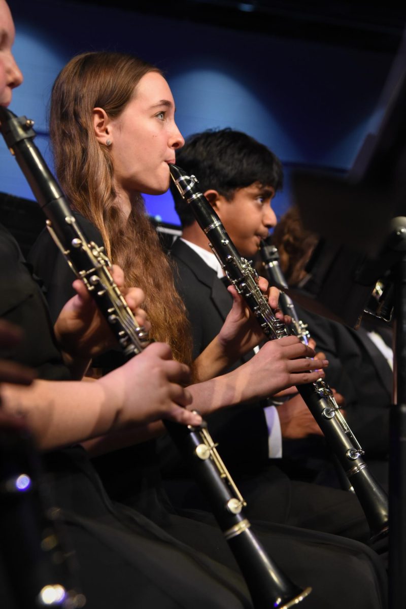 Pressing on the keys of her clarinet, freshman Marleigh Wyatt plays the song “Devotions” with the Concert Band. On Nov. 14, months of preparation paid off for this group as they performed their pieces; for Wyatt, it was the beginning of her high school band career. “I had fun playing in the theater instead of the middle school gym [like last year]. We practice in band class every day and go [to the band classroom] in AcLab to prepare, so It’s great to be up there on the stage,” Wyatt said.