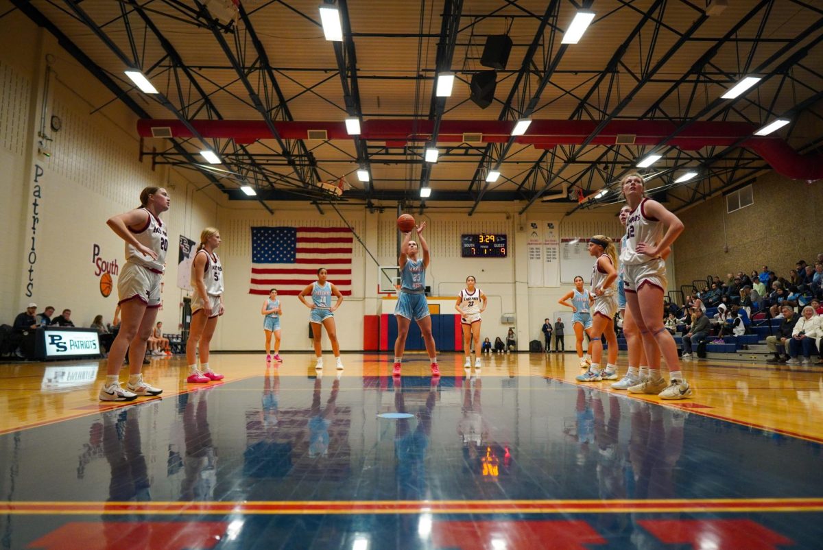 As the entire gym watches, senior Siena Snyder shoots a free throw during the varsity girls basketball game against Parkway South on Dec. 3. Snyder has played basketball at a competitive level for four years now, and she originally joined the team because of the upperclassmen. “I handle pressure during games by trusting my teammates and my coach and just knowing that our game plan is going to work. My teammates are some of my best friends, and we should be able to make a really good run at playoffs," Snyder said.