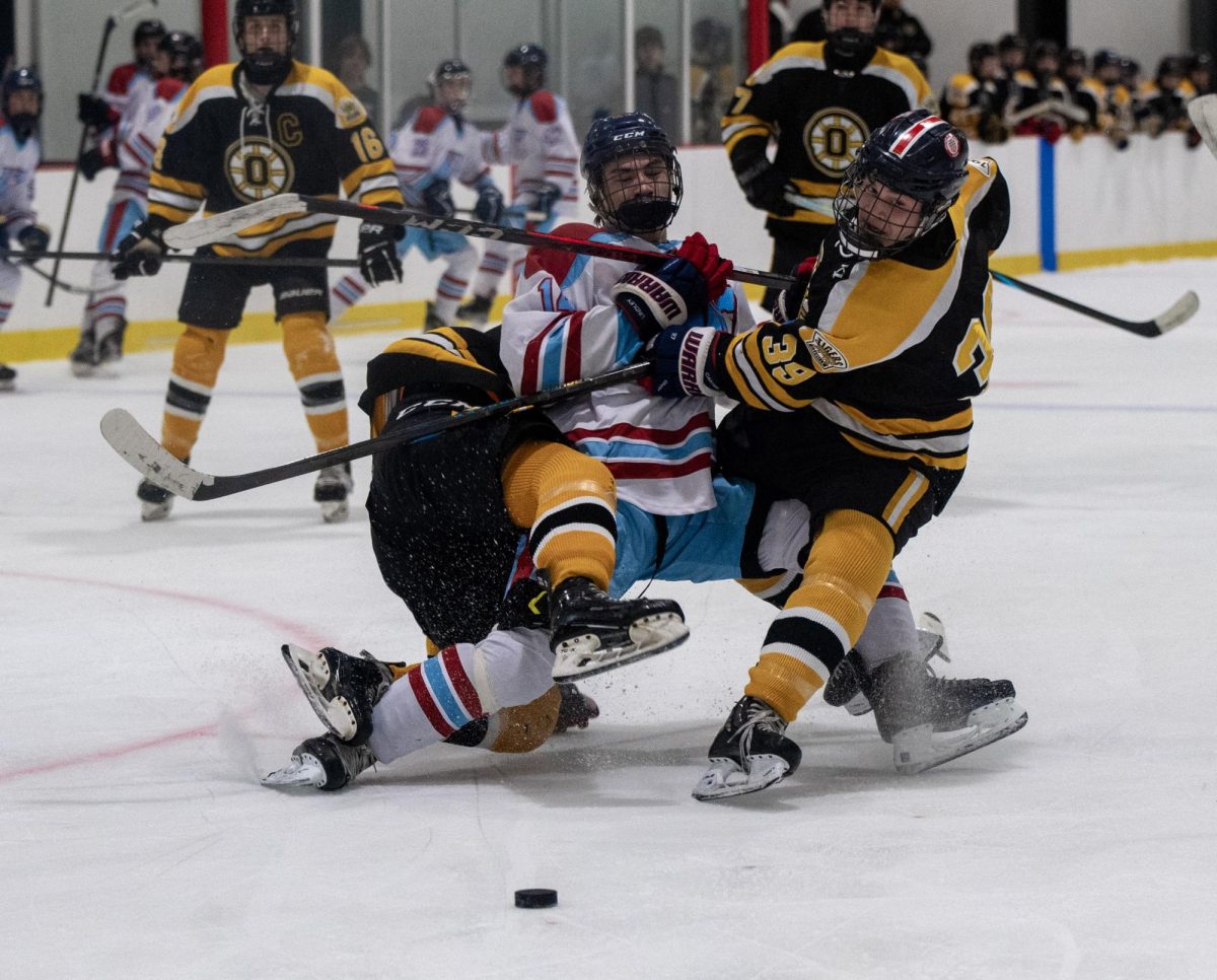 Attempting to skate the puck between two Oakville defenders, senior Caden Lindley gets closed in. On Jan. 16, Lindley was honored before the game for senior night at Queeny Recreational Complex. “It was weird to be spotlighted as a senior since I’ve always looked up to other classes and didn’t realize how close my time as a senior was. [But,] it was definitely nice to play in honor of our class,” Lindley said. 