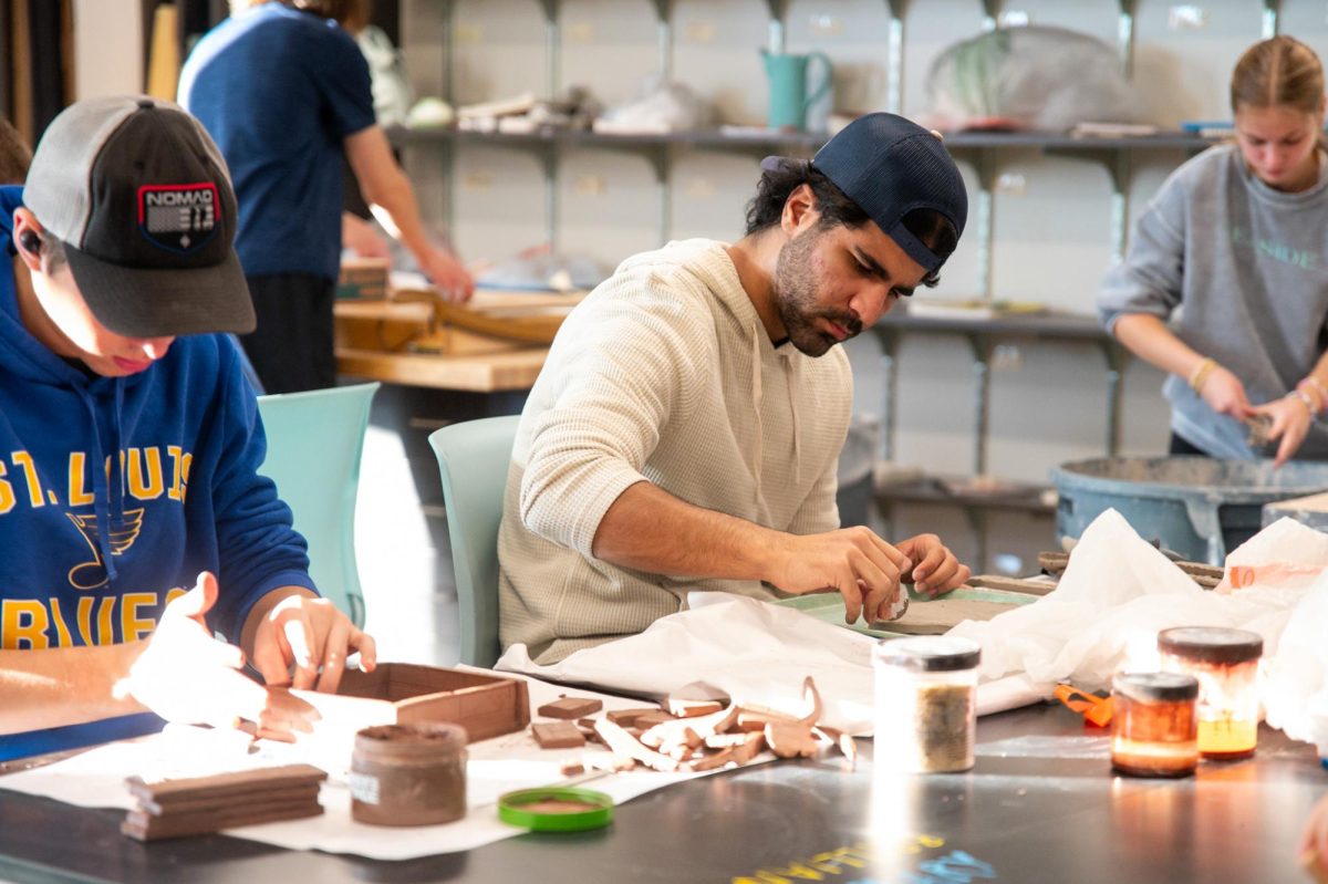 Building the base, junior Zaid Aujaimy creates a zen garden in Ceramics on Feb. 25. Aujaimy learned about making plants and rocks out of clay and incorporated those into his garden. “The most significant lesson I learned in Ceramics was to be patient [and] gentle and [to] think about unique ways to approach things and use my resources. I enjoy [Ceramics] class because I can express my creativity. It's not like other classes where there's a specific way to do something. I can [go] about it however I want and make good art my own way,” Aujaimy said.