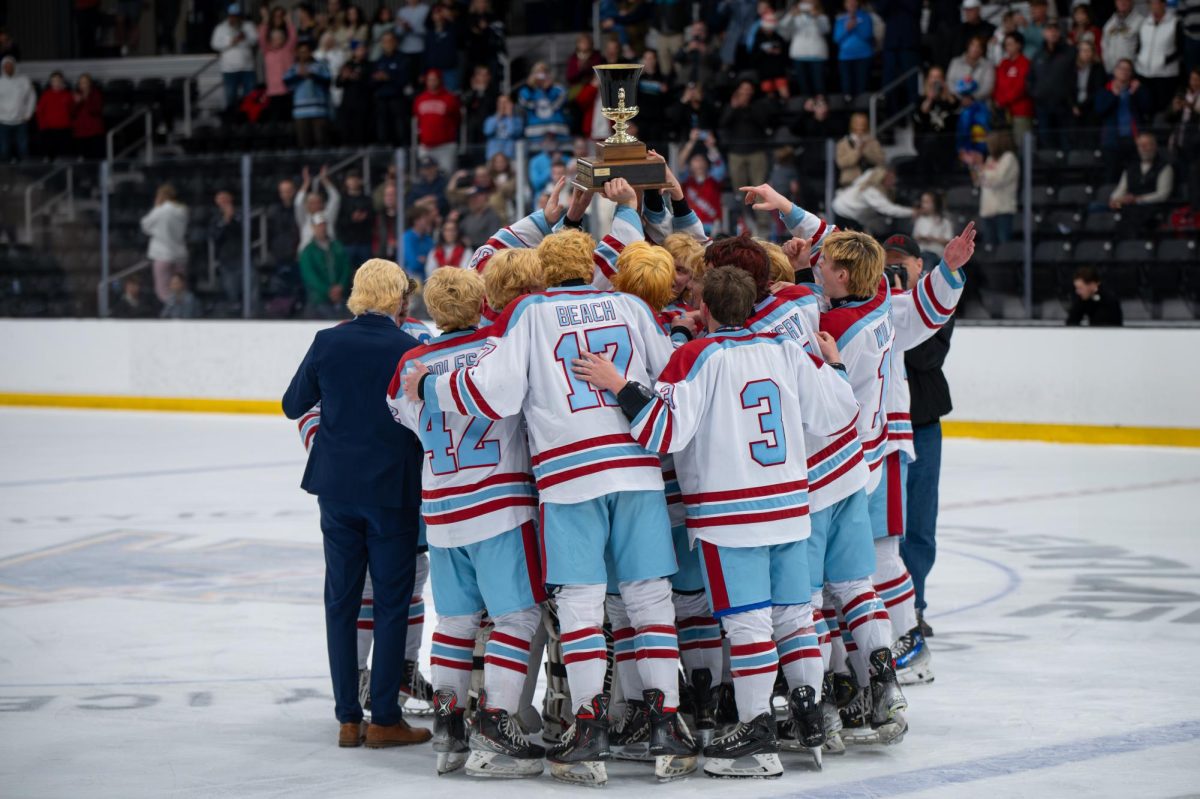 Celebrating their landmark victory, the Parkway West Boys Hockey team gathers together on the ice. Over the course of the season, the team grew closer together while pursuing their final goal: winning the coveted Wickenheiser Cup. “[Winning the cup] was awesome. [As] a senior, it was super rewarding to end on a high note. It had to be the most memorable part of my career,” varsity hockey player and senior Hunter Beach said. 