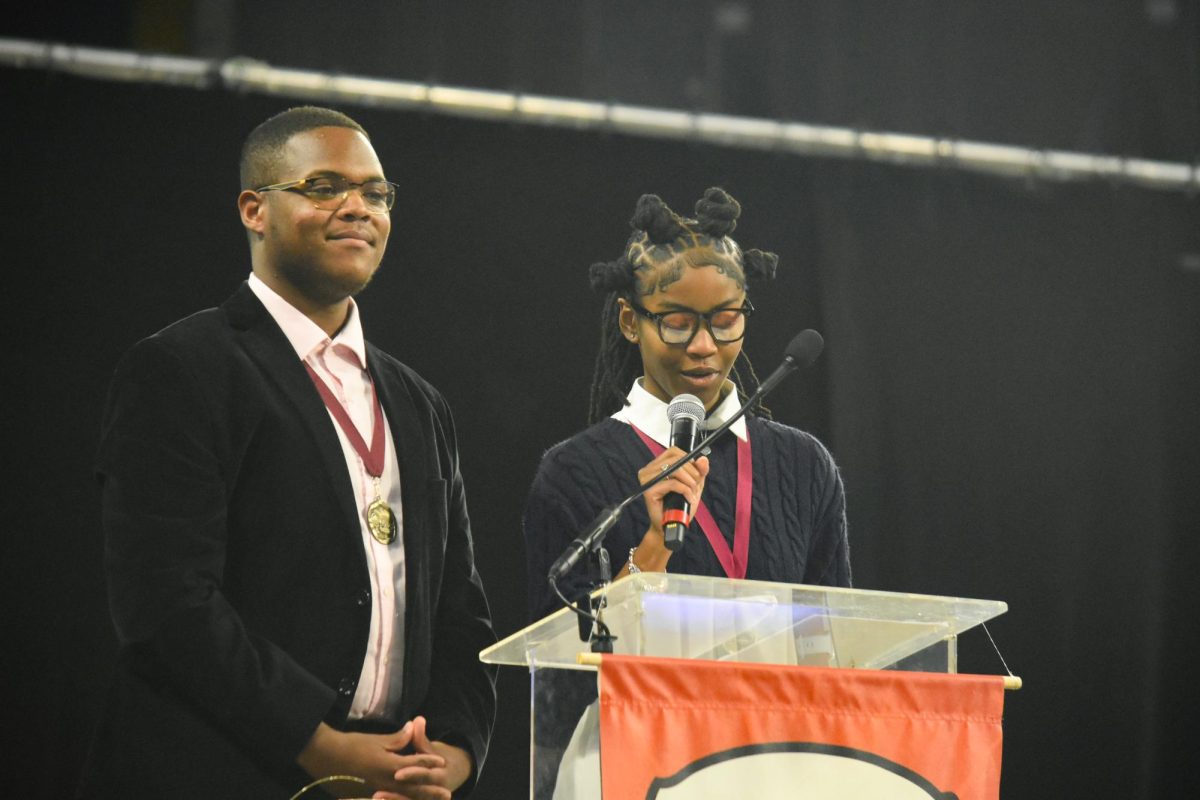 Sophomore Trent Young and junior Jamaya Love rise to the stage and welcome the audience after superintendent Keith Marty introduces them. Principals John McCabe and Kate Piffel selected them to be emcees for the 2025 Spirit of Excellence ceremony. “It is an honor and a privilege to stand before you this evening. Each one of the recipients tonight has exceeded all academic expectations and should be celebrated,” Love said.