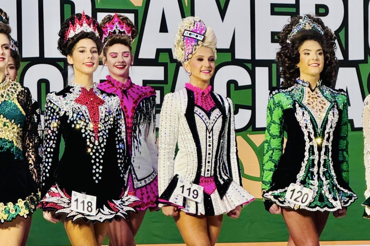 With her hands by her side and her posture straight, freshman Sophia Stricker gets into position for her Irish tap dance routine. Stricker has been Irish dancing since she was a child, following her family’s Irish heritage. “Irish dancing originated from Irish folk dancing and over the years has become very competitive. Now it’s seen not just at parades during St. Patrick's Day but there's a whole competitive side to it, where dancers compete at qualifiers to get to the World Championship,” Stricker said.