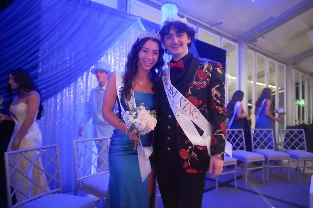 On May 3 at the Hilton DoubleTree Hotel in Chesterfield, Mo., seniors Emily Kate Beach and Jack Mullen celebrate together after being crowned Prom Queen and King. Prom court nominations were announced to the school via Instagram on Apr. 22. “We got an email from Taggart that we were on court, and then all the people on court started texting each other ‘good luck,’” Mullen said.