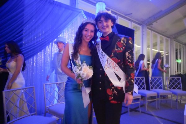 On May 3 at the Hilton DoubleTree Hotel in Chesterfield, Mo., seniors Emily Kate Beach and Jack Mullen celebrate together after being crowned Prom Queen and King. Prom court nominations were announced to the school via Instagram on Apr. 22. “We got an email from Taggart that we were on court, and then all the people on court started texting each other ‘good luck,’” Mullen said.