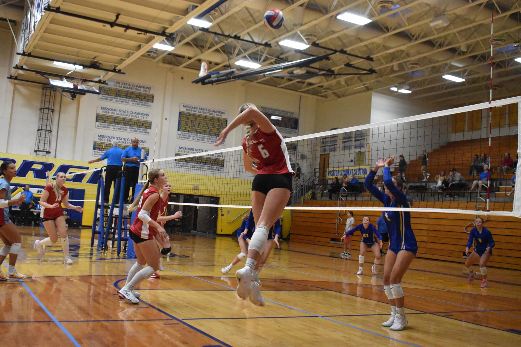 Jumping and spiking the ball, junior Katie Byergo tries to help lift her team above her opponents, Borgia High School on September 7th. Byergo has a huge role on the team, hitting the ball with power and blocking the opponents’ hits. ¨My favorite part of volleyball is winning games with my friends and hitting the ball hard,¨ Byergo said.
