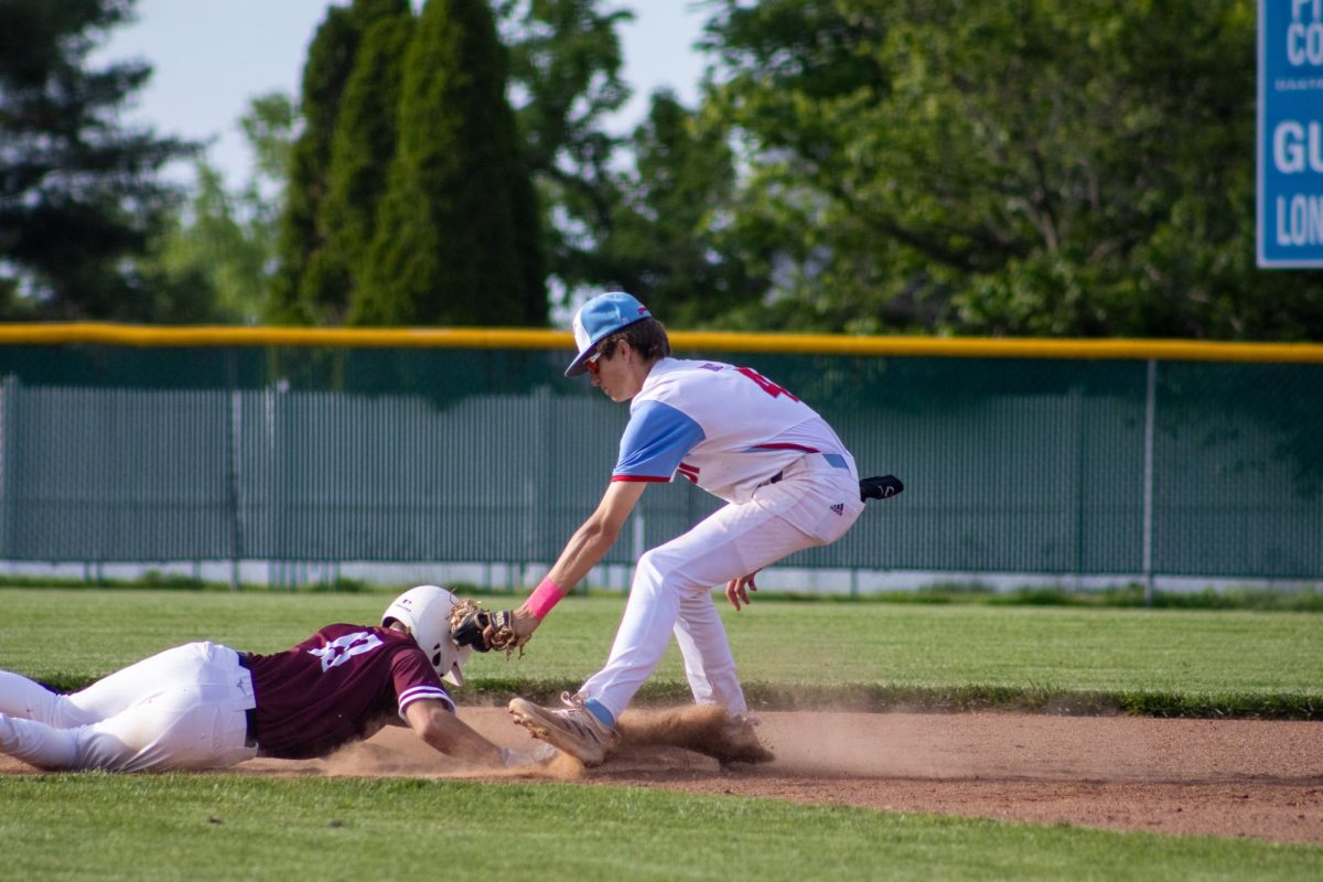 Covering second base, junior Ethan Brookshire attempts to tag out the runner on May 7 against Rockwood Summit. Following a successful doubleheader on April 18, Brookshire said he felt a spark throughout the team that kept them motivated. “It’s a very competitive schedule and team. We all work well together and push [each other] to become the best versions of ourselves we can be. It’s [a] really fast [game], so cooperation is important.” Brookshire said.